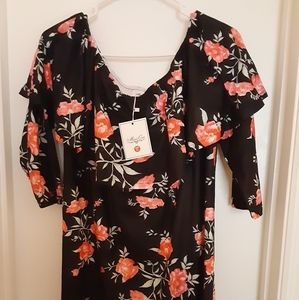 Maternity black dress with flowers.